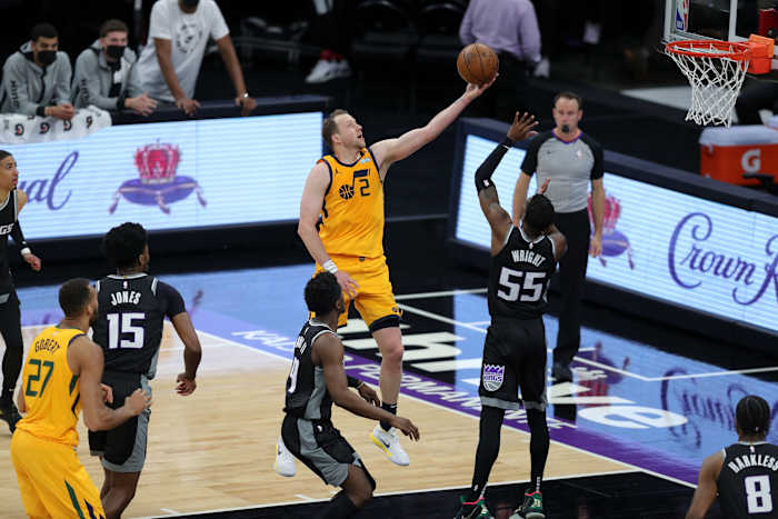 Joe Ingles (2) scores over Delon Wright (55) and the Sacramento Kings on Wednesday night